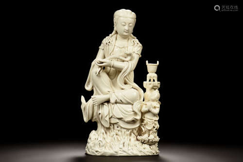 HE CHAOZONG: DEHUA BLANC DE CHINE CARVED GUANYIN FIGURE