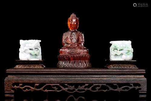 AMBER CARVED BODHISATTVA AND PAIR OF JADE CARVED LIONS