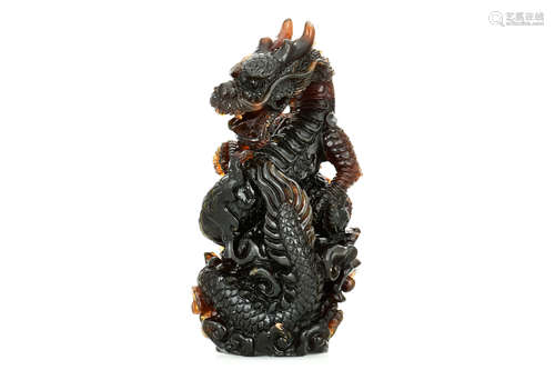 AMBER CARVED 'DRAGON' FIGURE WITH GIA CERTIFICATE