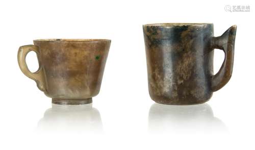 74. TWO JADE CARVED TEA CUPS, DARK COLOR