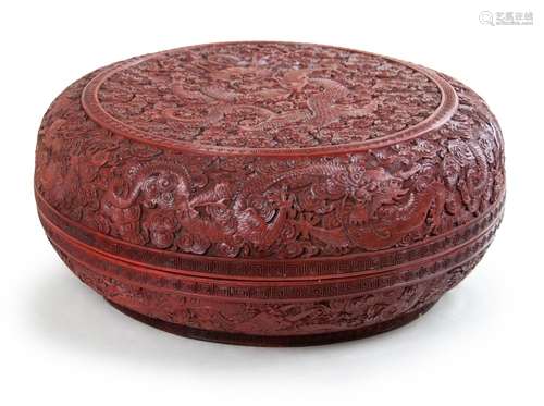 320. A LARGE CARVED CINNABAR LACQUER BOX NINE DRAGONS