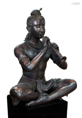 94. LARGE SEATED FLUTE PLAYER