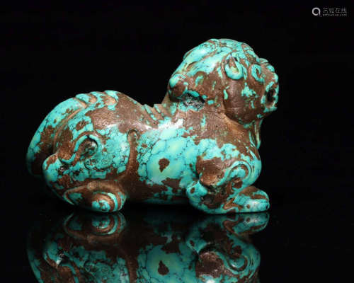 A TURQUOISE CARVED BEAST PENDANT