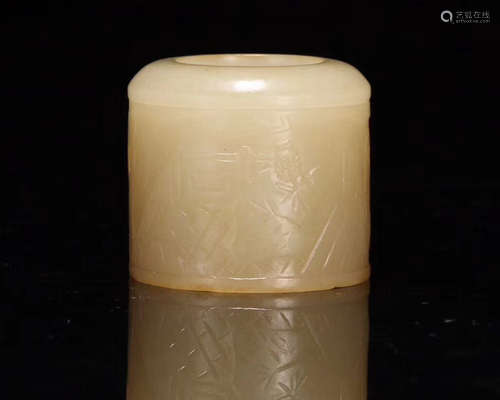 A HETIAN JADE CARVED ARCHER RING