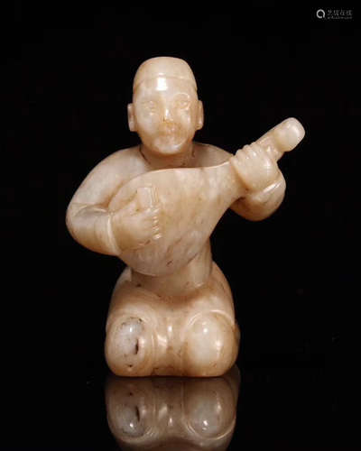 A HETIAN JADE CARVED FIGURE OF MUSICIAL