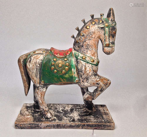 A CARVED WOODEN COLOR PATTERN HORSE