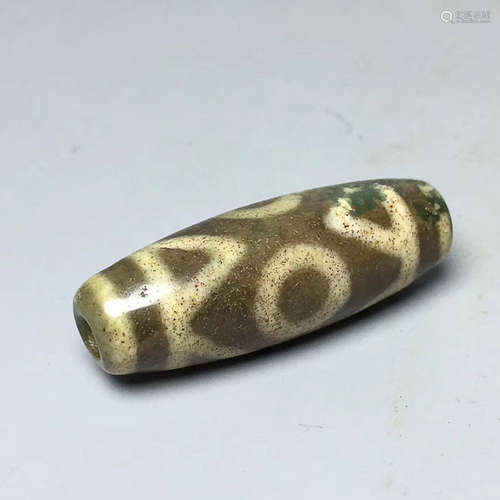 A TIBETAN THREE-EYE DZI BEAD