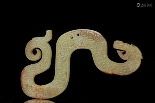 A Chinese Pale-White jade S shaped dragon from Warring States period