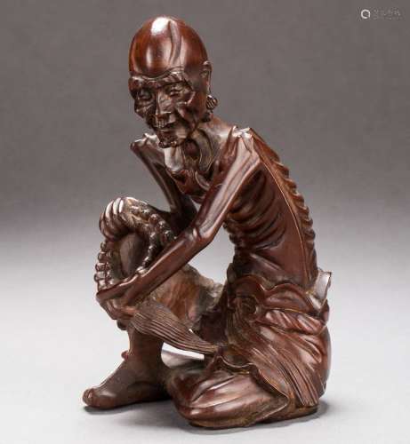 A Chinese carved boxwood figure of Luohan from Qing Dynasty