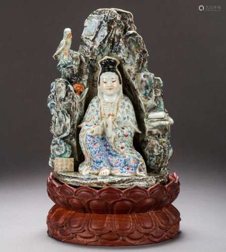 A Chinese famille-rose Guanyin on wooden shrine from Qing Dynasty
