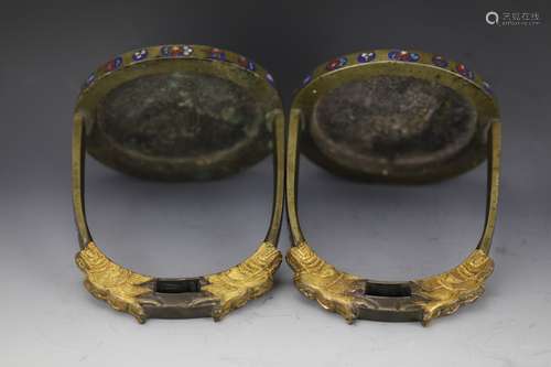 A Chinese pair of Chinese bronze cloisonne stirrups