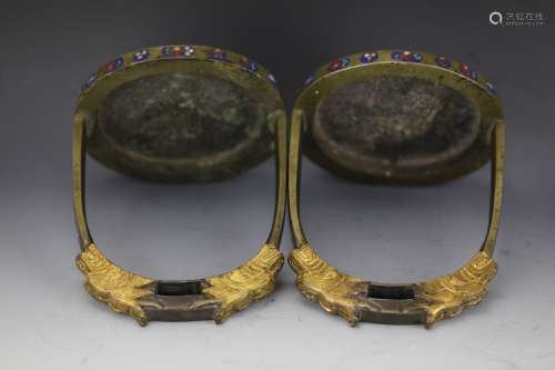 A Chinese pair of Chinese bronze cloisonne stirrups