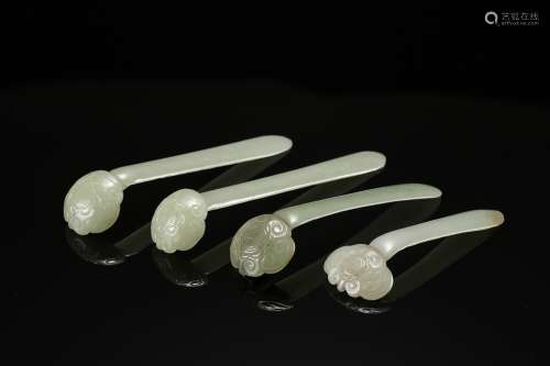 A group of four carved jade Ruyi hair pins from Ming Dynasty