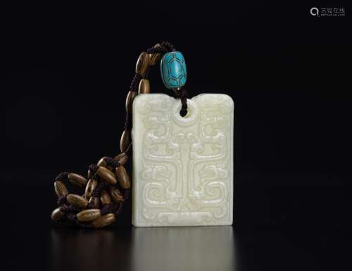 A White Jade Carved Dragon Pendant