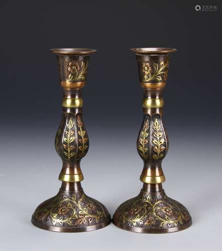 A Pair Of Metal Candle Sticks