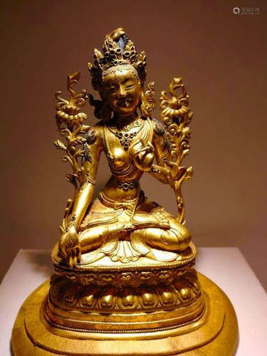 A GILT BRONZE CARVED FIGURE OF DUMU BUDDHA