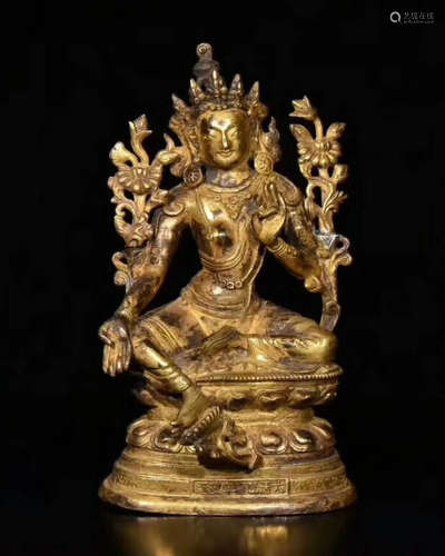 A GILT BRONZE CARVED FIGURE OF BUDDHA