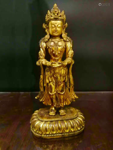 A GILT BRONZE CARVED FIGURE OF BUDDHA