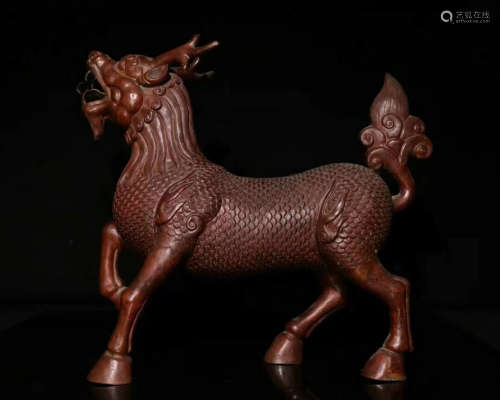 A BRONZE ORNAMENT WITH BEAST DESIGN