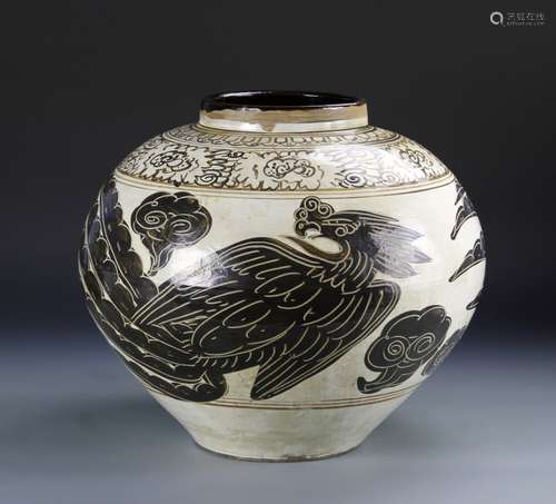 China, Song-Yuan period, Cizhou Yao phoenix jar in a bulbous form, with phoenix design painted in black on an off-white ground.