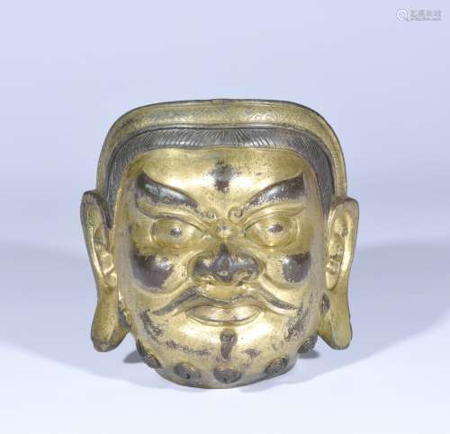 A GILT-BRONZE HEAD OF BUDDHA