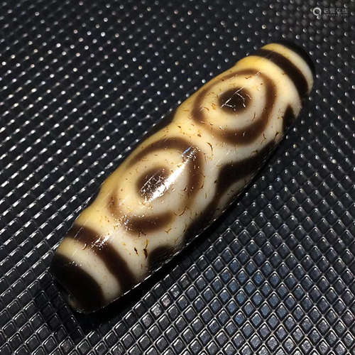 AN OLD ORE CHARGE DRAGON EYES DZI BEAD