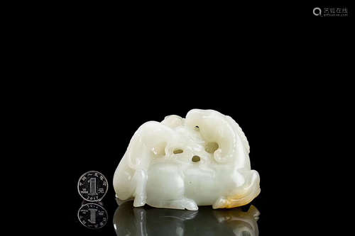 A HEITIAN WHITE JADE HOLLOW-OUT PAPERWEIGHT ORNAMENT