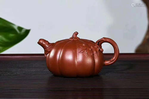 A YIXING POTTERY PUMPKIN SHAPED  PURPLE CLAY TEAPOT