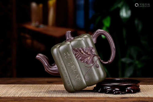 A DARK GREEN MARL WATERMELON SHAPED CLAY TEAPOT