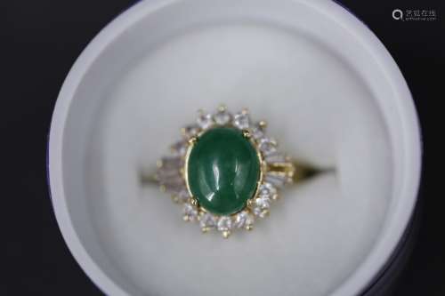 A jadeite with diamonds on 14k gold ring