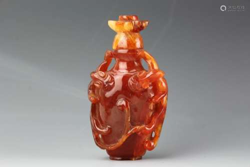 Chinese carved Cornelian snuff bottle with matching