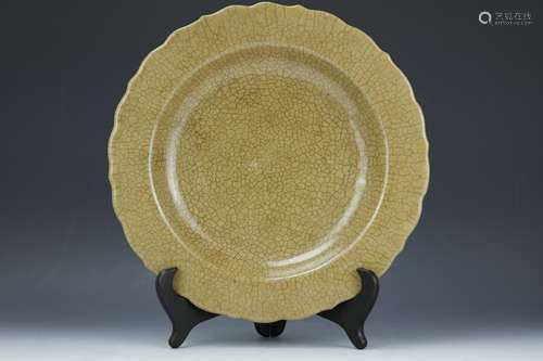 A brown ceramic Ge glazed plate