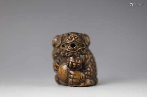 Vintage Netsuke carved rosewood foo dog lion with ball