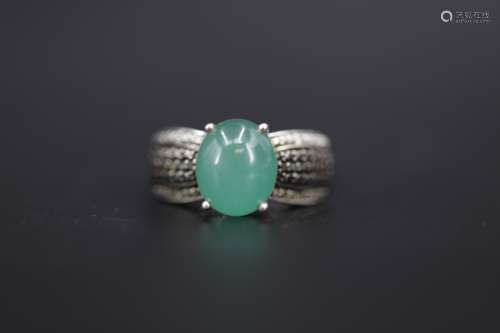 A pale-green jade on sterling silver ring