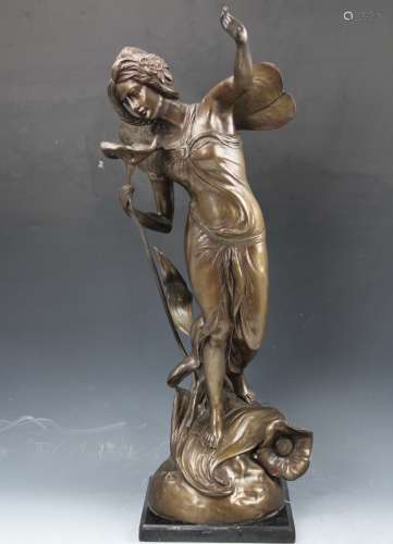 A bronze statue of a flower fairy on marble base
