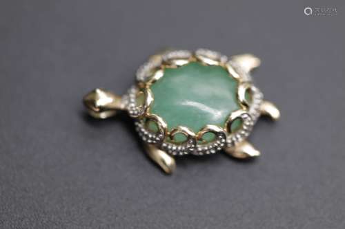 A jade turtle with diamonds on sterling silver pendant