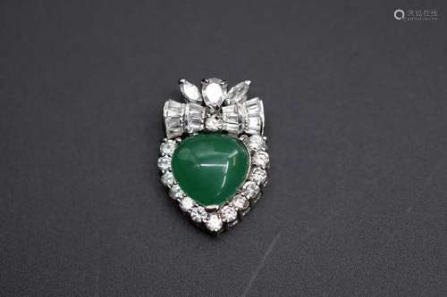 A heart-shaped jadeite surrounded with crystals pendant