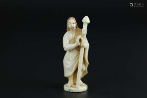 Japanese Netsuke carving of Jesus holding a cross