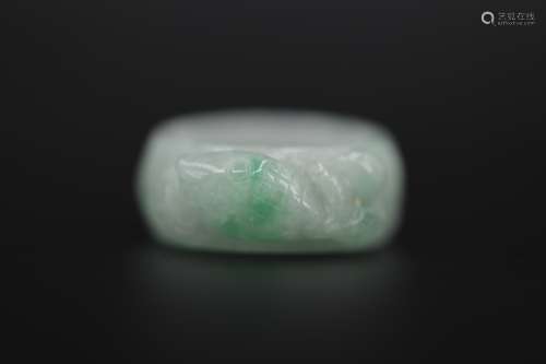 A carved jadeite coifish ring