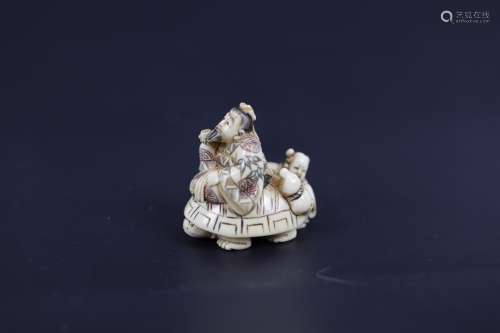 A Carved Netsuke of an Immortal and A Child Riding a
