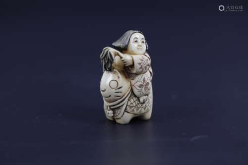 A Carved Netsuke of A Woman Riding the Lucky Cat Signed