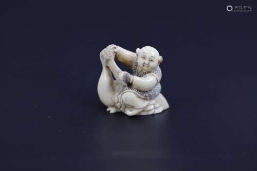 A Carved Netsuke of A Child with Duck Signed