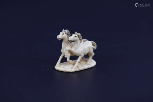 A Carved Netsuke of Two Horses Signed
