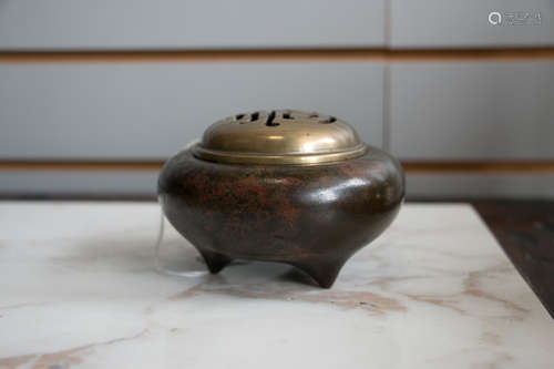 A bronze incense