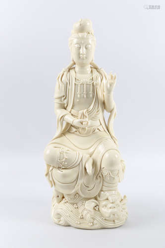 A porcelain GuanYin statue