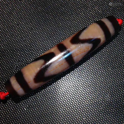 A TIGER-TOOTH DZI BEAD