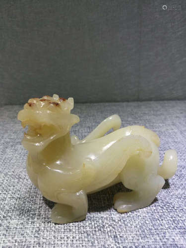 A JADE CARVED BEAST PENDANT