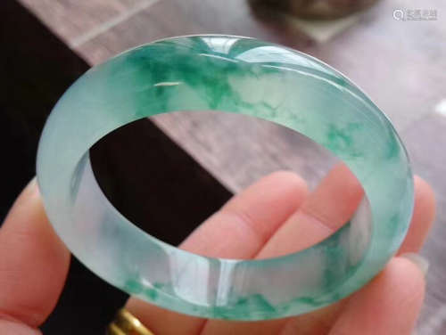 A NATURAL JADEITE BANGLE WITH CERTIFICATE
