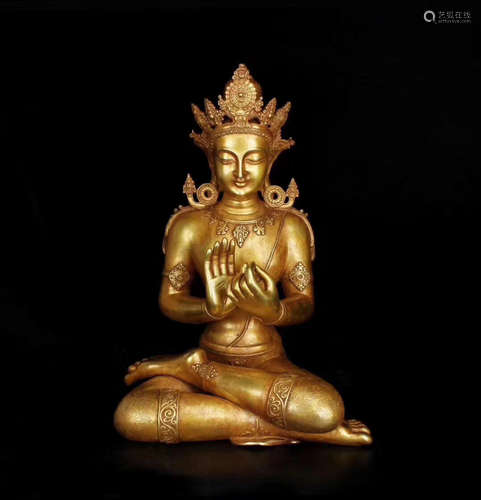 A GILT BRONZE CARVED BUDDHA FIGURE