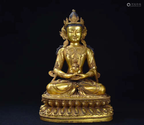 A GILT BRONZE CARVED BUDDHA FIGURE